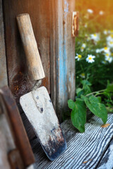 Photo construction trowel. Old cement kneading blade. Construction theme..