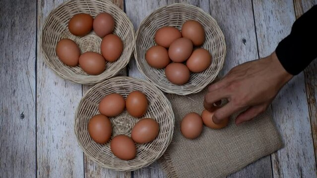 Don't put all your eggs in one basket concept. eggs in a rattan basket