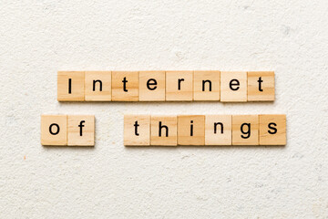 internet of things word written on wood block. internet of things text on cement table for your desing, concept