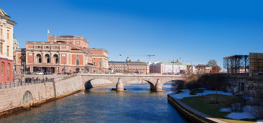 west facade of the royal opera theatre and norrbro bridge across the river 