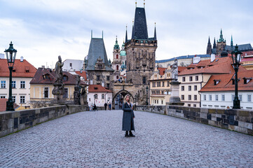 Portrait of a young beautiful girl on the street in Prague.