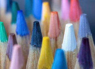 Macro close up of top ends of sharpened coloured pencils in a cluster, nobody	

