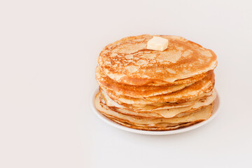 Staple of yeast fluffy pancakes with butter. Spring holiday Traditional Russian Shrovetide...