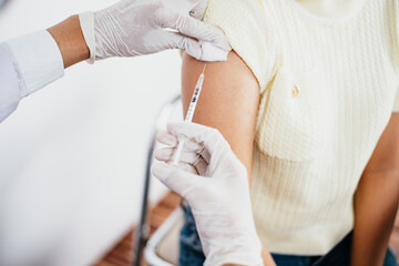 Doctor in medical gloves giving of flu patients