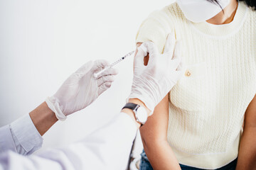 Doctor in medical gloves giving of flu patients