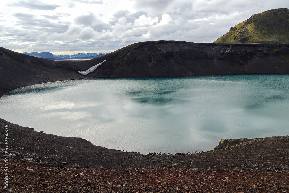 Wall mural blue lake in mountainous iceland