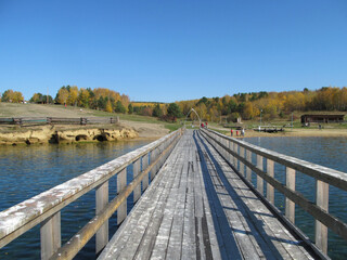 wooden bridge across the river, outside the city, a place of rest for citizens