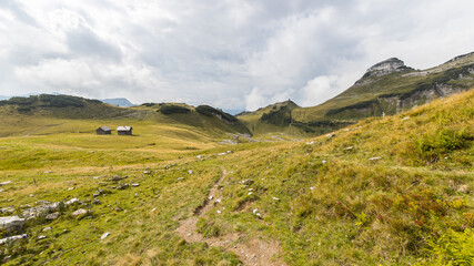 Alpine mountain range with remote huts and cabins owned by mountain farmers in Austria