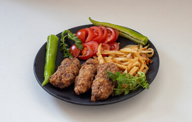 Turkish style meatballs. Turkish cuisine delicacies. Meatballs fried in breadcrumbs. local name Kadin Budu Kofte or Women's Leg Meatballs. 