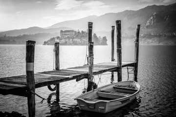 island of orta san giulio, taken from the shores of orta lake, of glacial origin, is a little lake in northern italy, piedmont region, divided between the provinces of novara and verbania.