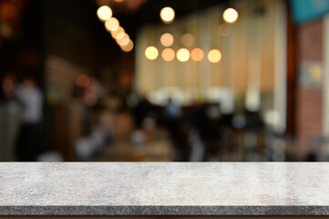 Empty white marble stone table top and blur interior cafe and restaurant.	
