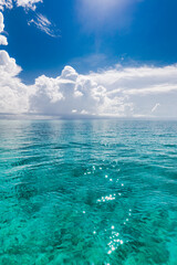 Calm sea ocean and blue sky with clouds background. Tranquil water reflection, relaxing natural scene. Exotic tropical Mediterranean sunny summer seascape. Amazing travel nautical background 