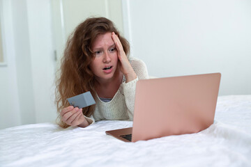 Internet fraud. Nervous sad upset unhappy confused young woman, stressed worried lady having...