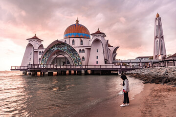 Melaka Straits Mosque Masjid Selat Melaka at sunset light Melaka Malaysia