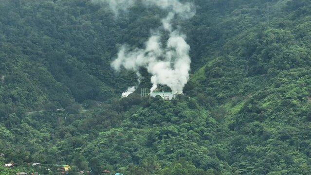 Aerial drone of geothermal power production plant. Geothermal station with steam and pipes. Negros, Philippines.