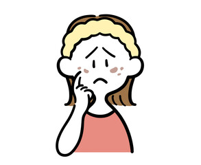 顔のシミを気にする女性