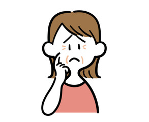 顔のシワを気にする女性