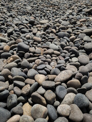 Fototapeta na wymiar pile of smooth stones with round shape