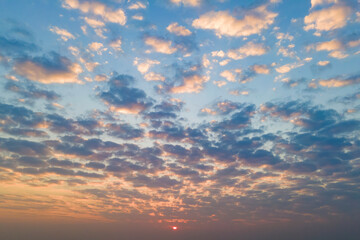 Naklejka na ściany i meble Cirrus clouds on the sunset sky