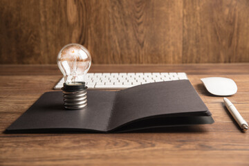 Keyboard, notepad and light bulb. Concept Idea