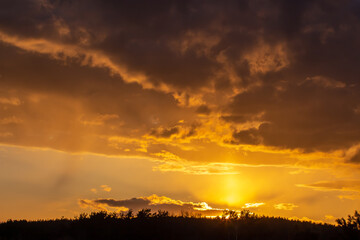 Natural sunset Sunrise over a field or meadow.