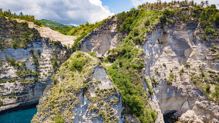 Aerial beautiful scenery view of Tree House (Rumah Pohon), at Atuh Beach, Nusa Penida, Bali, Indonesia