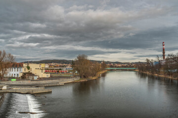 Fototapeta na wymiar River Otava and weir with footbridge near Pisek town in south Czech in evening