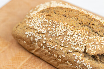 Homemade delicious integral flour bread sliced on the wooden board