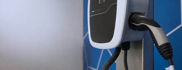 EV Charger quick charge type at car parking which DC Charging faster than AC system. EV Charger car station charging use AC socket plug for electric engine vehicle. Future transport energy technology