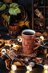 Still life with tea cup and lights garland