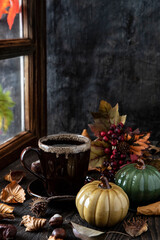 Autumn still life with coffee mug on  wooden table