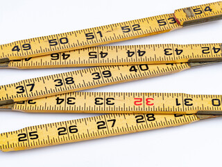 Old wood folding ruler with colored numbering