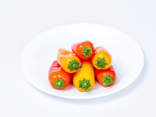 Colorful peppers in a plastic storage container