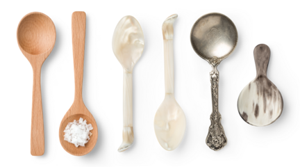set of different spoons, wooden, mother-of-pearl, silver and horn ones, isolated food, cosmetics or lifestyle design elements, top view / flat lay