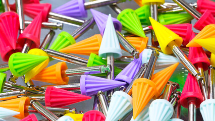Many dental tools drills different colors close-up, dentistry concept background - Powered by Adobe