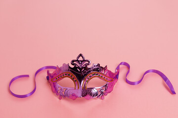 Multicolored carnival mask on blue background. Purim.