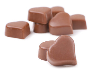 Chocolate candies, hearts, white background
