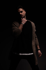 fashion model touching his chin slowly