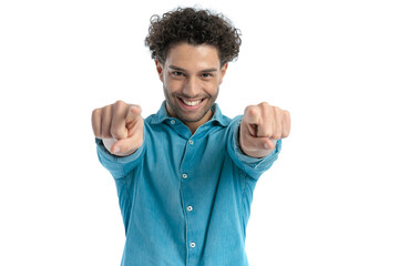 lebanese man with curly hair smiling and pointing fingers