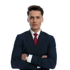 businessman crossing his arms and smiling at camera