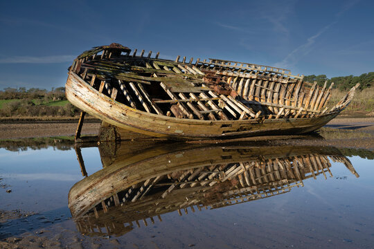 Abandoned wreck of a wooden fishing vessel at Traeth Dulas on Anglesey