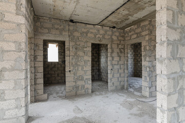 Fototapeta na wymiar Construction of an individual residential building, view of the doorways to the bathrooms and rooms