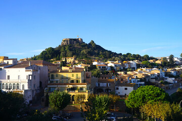 Fototapeta premium views to the Castell de Begur on top of a hill in the middle of the old town Begur in Catalonia, Costa Brava, Girona, Catalonia, Spain