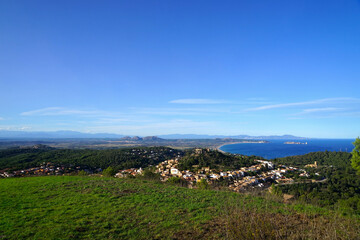 Fototapeta na wymiar View over Begur with its hilltop castle over the beautiful countryside of Catalonia and the Mediterranean Sea to the Pyrenees, Illes Medes, Castell del Montgrí, Catalonia, Costa Brava, Spain
