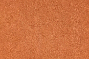 Fototapeta premium Orange plastered wall. Texture, background, free space for text. High resolution