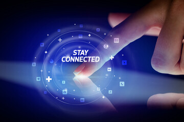 Finger touching tablet with social media icons concept