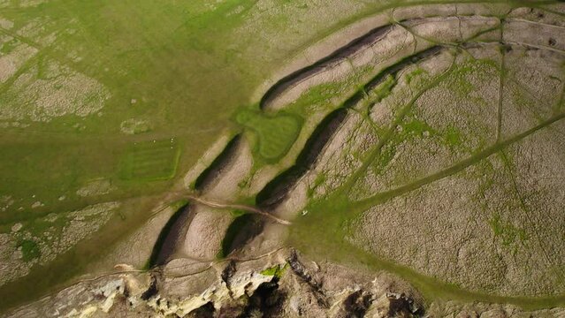 Aerial view of Cleeve Hill Iron Age Hillfort ramparts and ditches