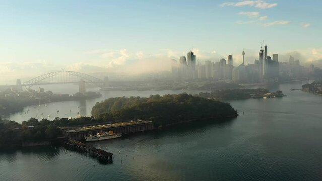 Coal loader old pier jetty on balls head in Sydney &ndash; aerial flying to CBD as 4k.
