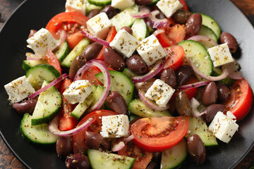 Greek salad with fresh vegetables, feta cheese, kalamata olives, dried oregano, red wine vinegar and olive oil. Healthy food.