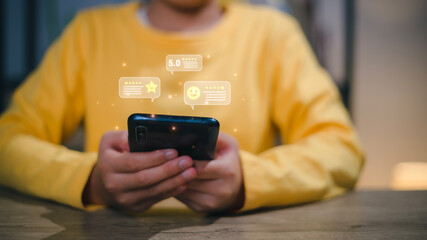Woman pressing face emoticon on the virtual touch screen at smartphone. Customer service evaluation...